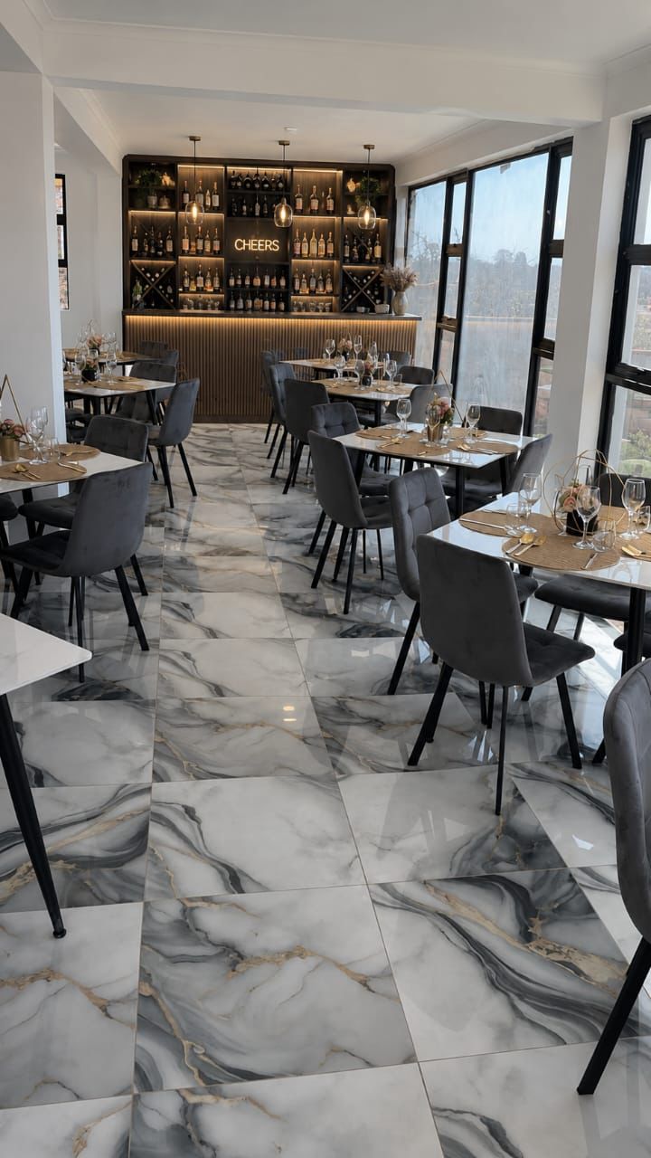 Lions Gate dining room with velvet chairs and the Cheers bar